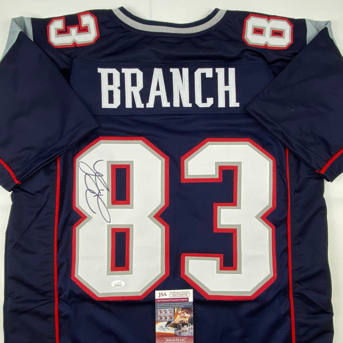 Autographed/Signed Deion Branch #83 New England Blue Football Jersey JSA COA