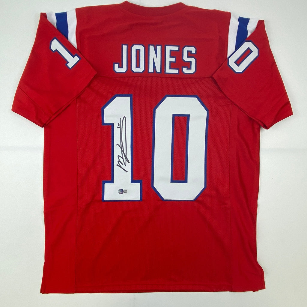 Autographed/Signed Mac Jones New England Red Football Jersey Beckett BAS COA