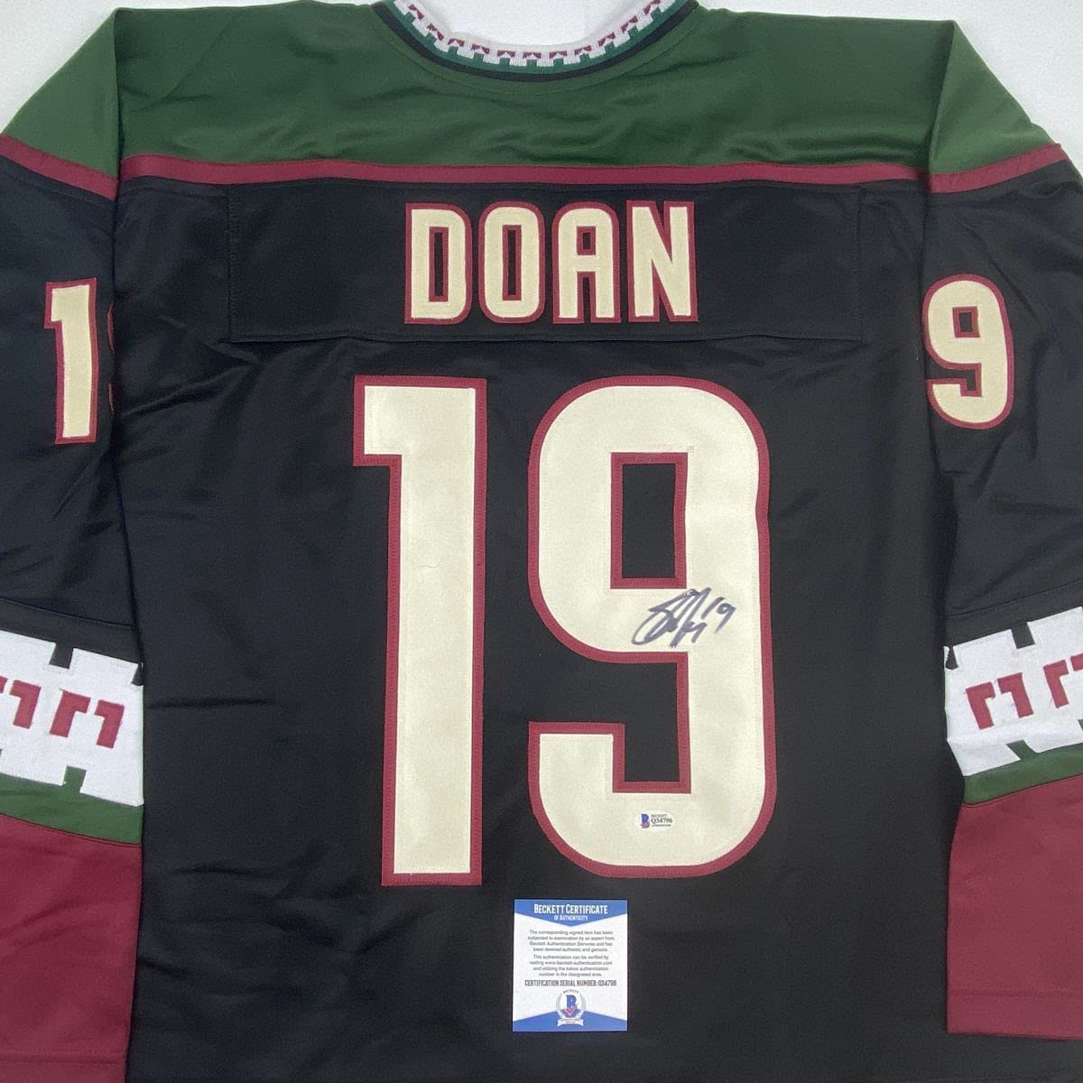 Autographed/Signed Shane Doan Arizona Black Hockey Jersey Beckett BAS COA
