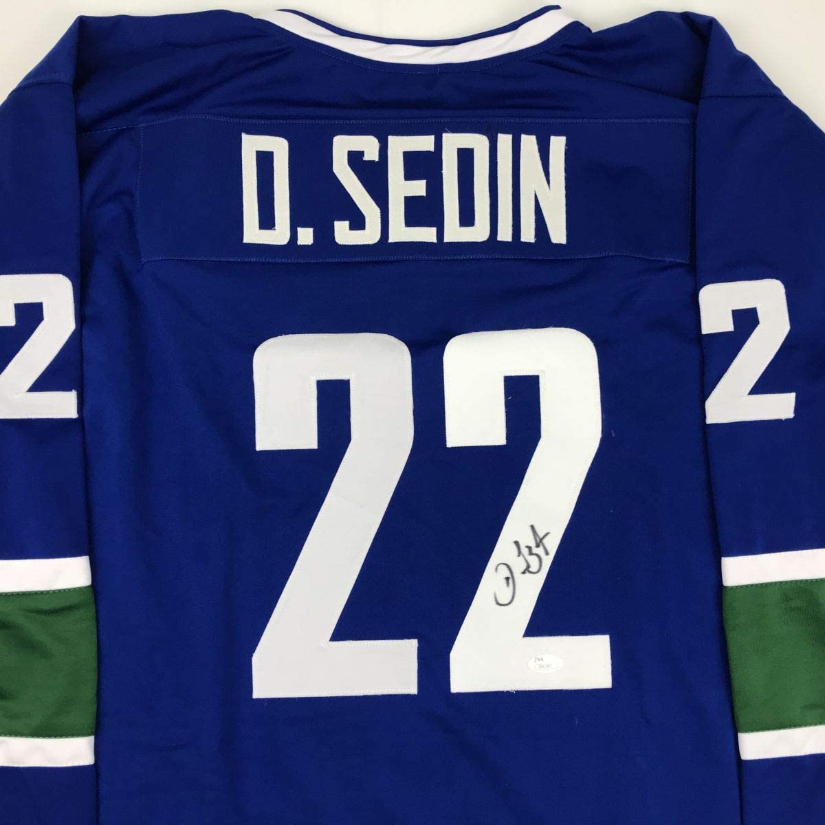 Autographed/Signed Daniel Sedin Vancouver Blue Hockey Jersey JSA COA Holo Only