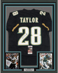 Framed Autographed/Signed Fred Taylor 35x39 Jacksonville Black Football Jersey JSA COA