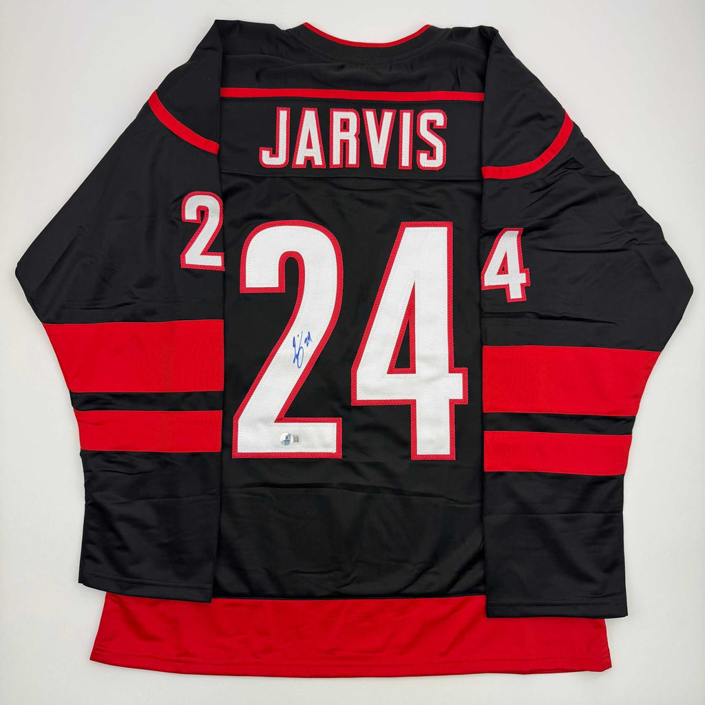 Autographed/Signed Seth Jarvis Carolina Black Hockey Jersey Beckett BAS COA