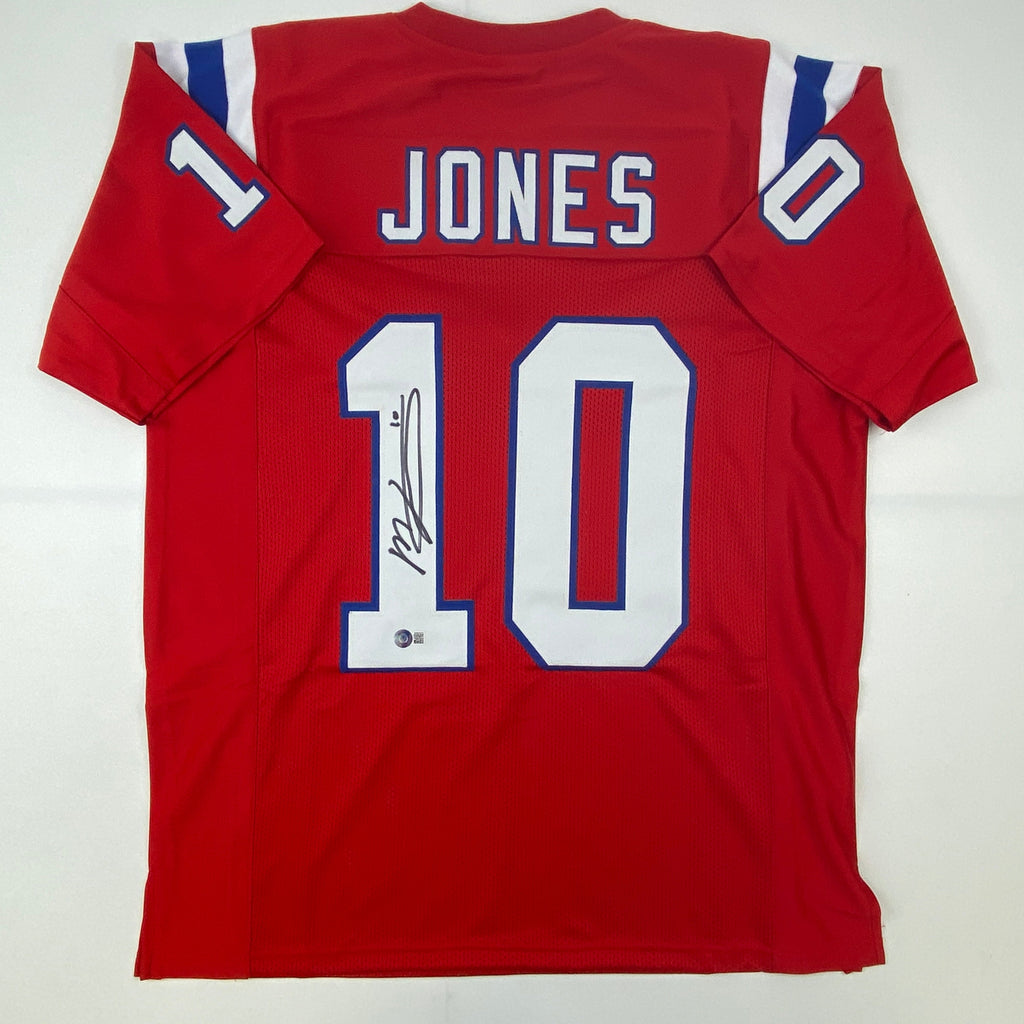 Autographed/Signed Mac Jones New England Red Football Jersey Beckett BAS COA