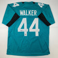 Autographed/Signed Travon Walker Jacksonville Teal Football Jersey Beckett BAS COA